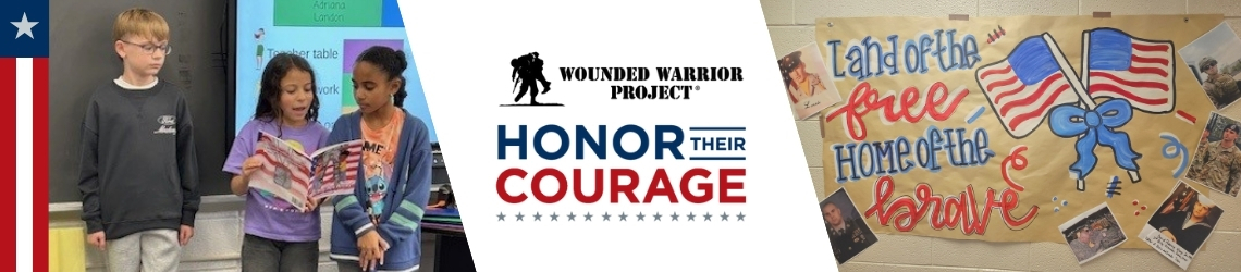 Students present in class for the Honor Their Courage service learning program with a poster of veterans and families.