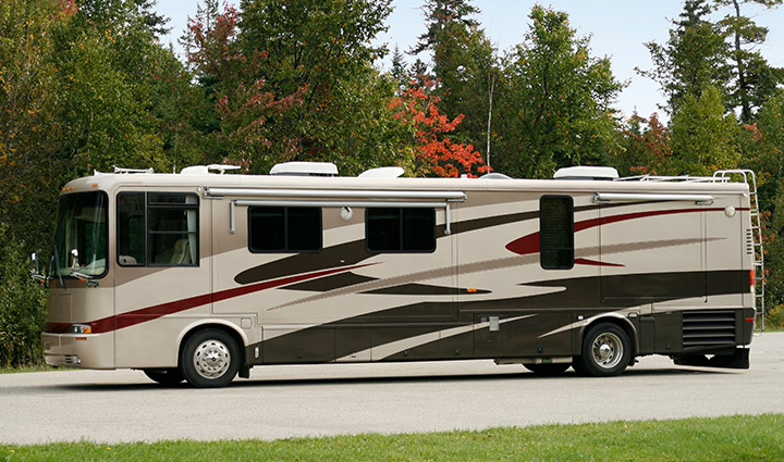 A motorhome with a generic scenic background.