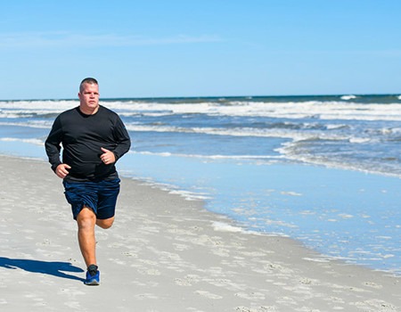Warrior Josh Wathen Running Along The Beach