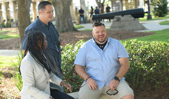 WWP warriors Danielle Green, Jason Major, and Jacob Norotsky talk outside.