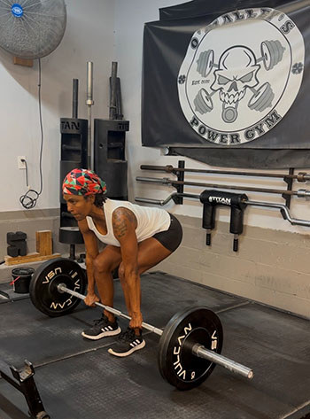 WWP woman warrior Tonya Oexndine lifts weight during training for her Mount Kilimanjaro climb.
