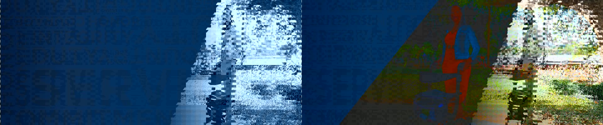 Wounded warrior Sharona Young stands outside using a walker