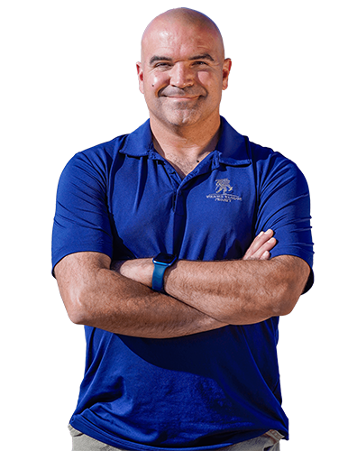 Wounded Warrior David Daly smiles while wearing a blue shirt.