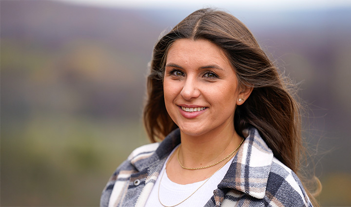 Wounded warrior Keara Torkelson smiles at the camera while the wind blows through her hair.