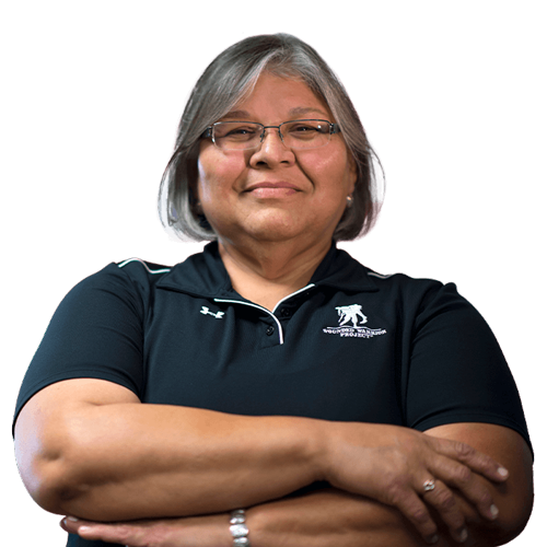 Gold Star Mother Mary Tallouzi stands proudly with her arms crossed.