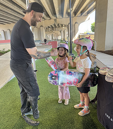 Harley Meagley talks to military kids at a skateboarding event in Jacksonville, Florida.